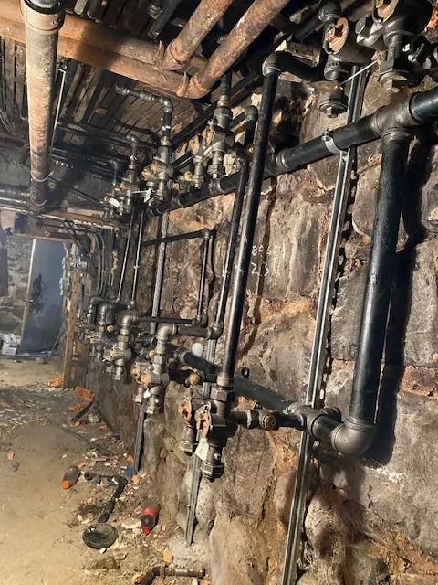 Exposed plumbing pipework and mechanical connections
